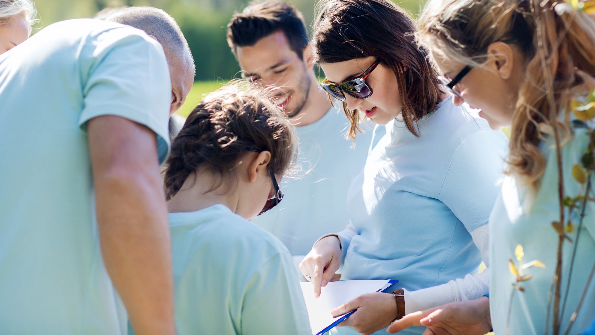 A group of people outside working together