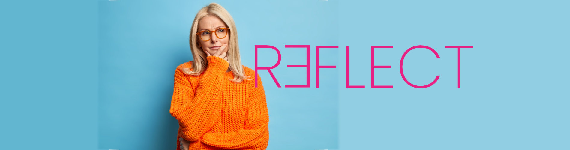 A blonde woman wearing glasses and an orange sweater doing a thinking pose resting her had on her chin