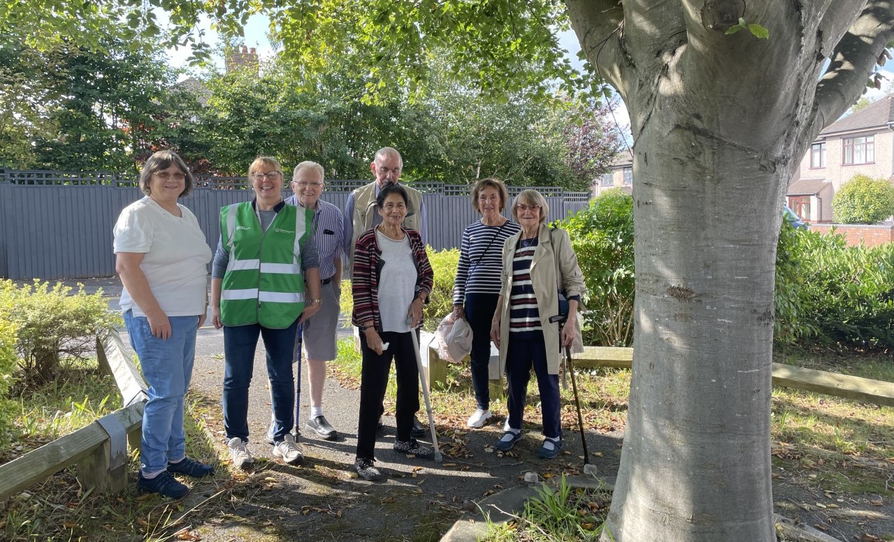 A group of 7 walkers standing for a group photo in Stockton Heath