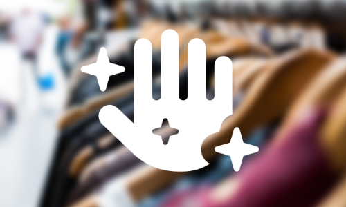 A blurred image of a clothes rail with a hand icon overlayed 